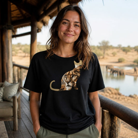 Woman wearing the Lioness boyfriend tee on a safari lodge deck - 12 Seconds Apparel